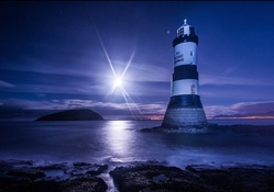 awesome lighthouse in a moonlit night