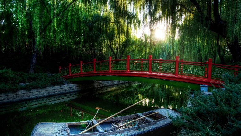 red bridge in a japanese park