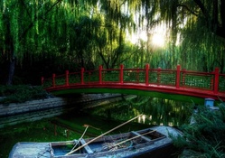 red bridge in a japanese park
