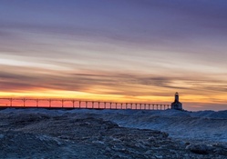 lighthouse at a winter sunset