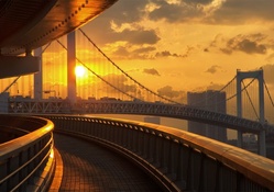 on ramp to bridge in sunset