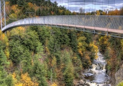 foot bridge over coaticook river in canada hdr