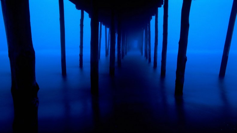 a_misty_night_under_a_pier.jpg