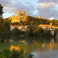 beautiful french castle on a hill in sunset