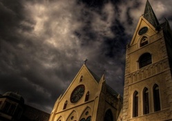 church rising to a stormy sky