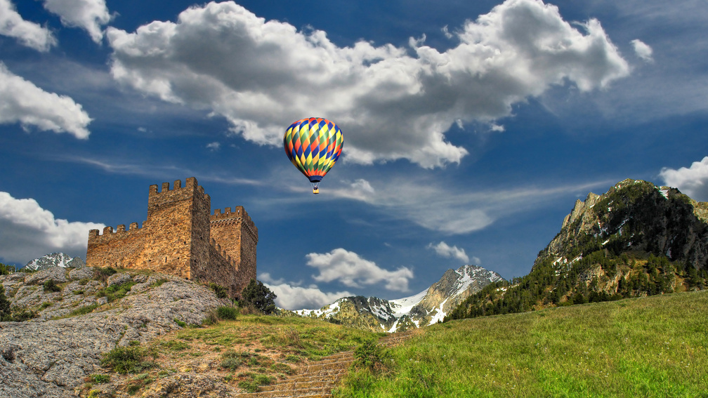 hot air balloon over ancient castle