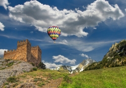 hot air balloon over ancient castle