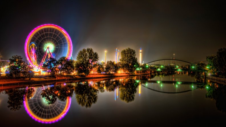 amusement parks by a river at night hdr