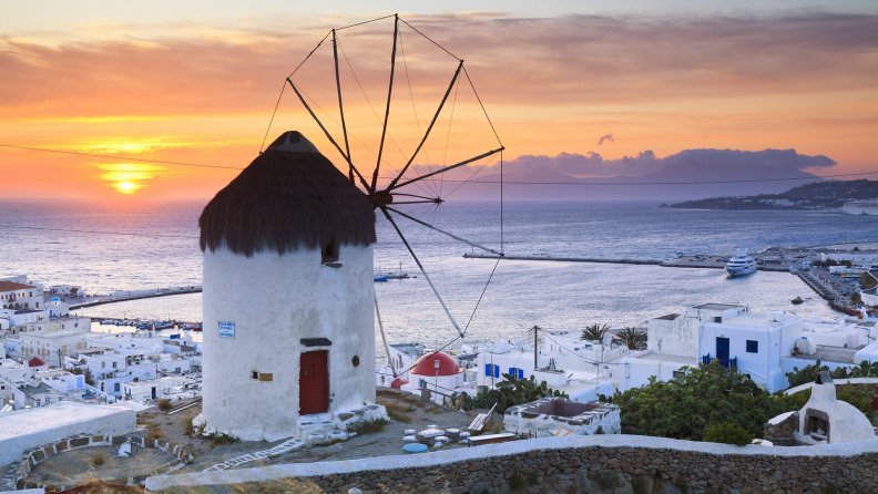 windmill on a greek isle at sunset