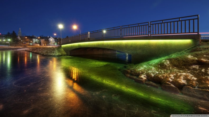 bridge_over_a_frozen_pond_at_night.jpg