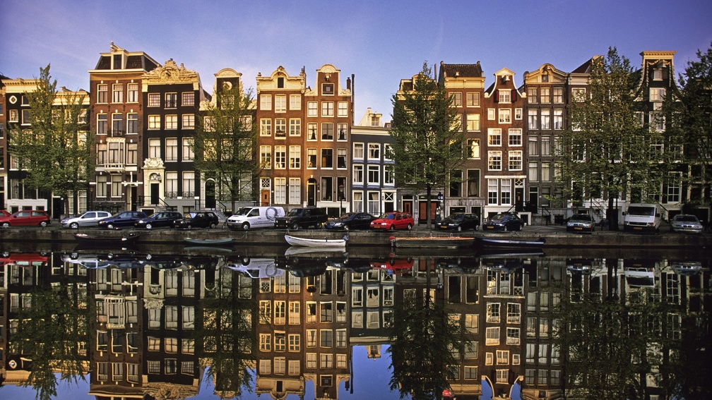 reflections in a canal in amsterdam