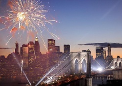 fireworks and lights over brooklyn bridge