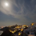 moon over a village on a greek island