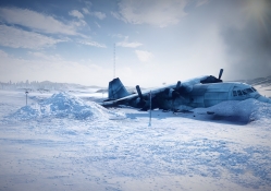 crashed plane in a wintry airfield