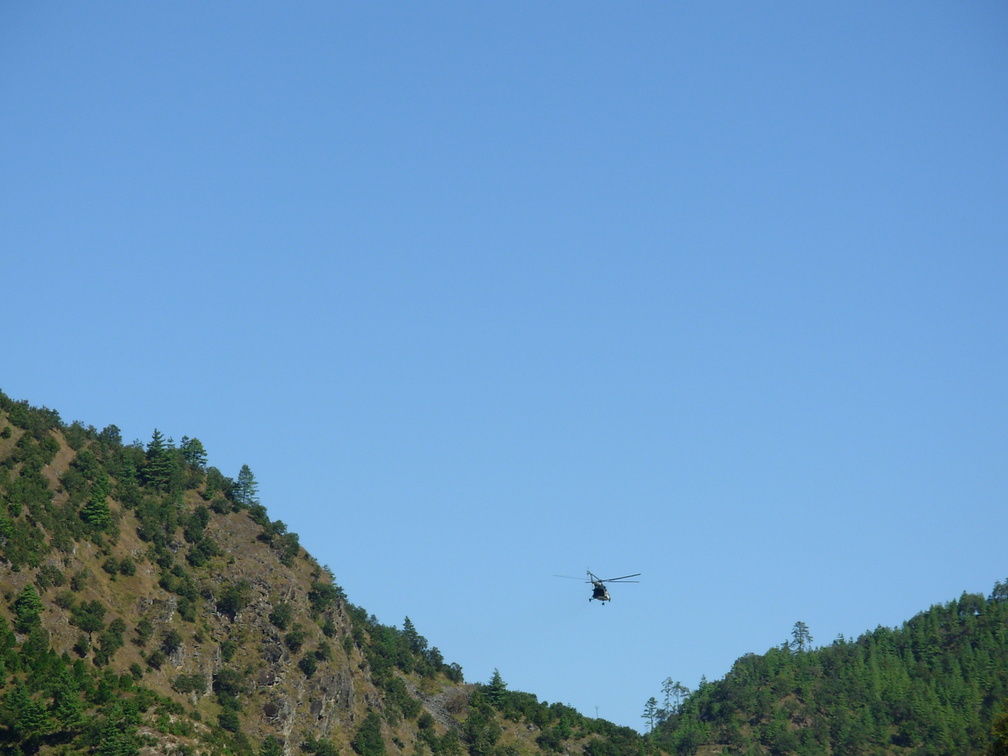 Halicaptor flying between hills