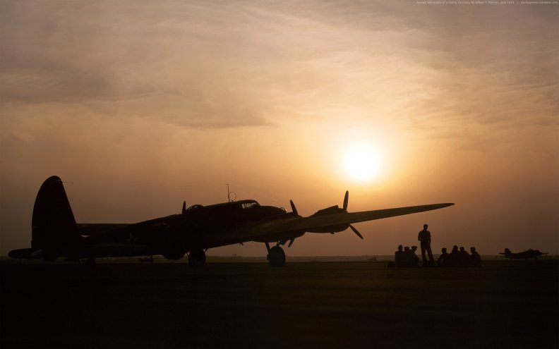 Sunset silhouette of a B_17 flying fortress