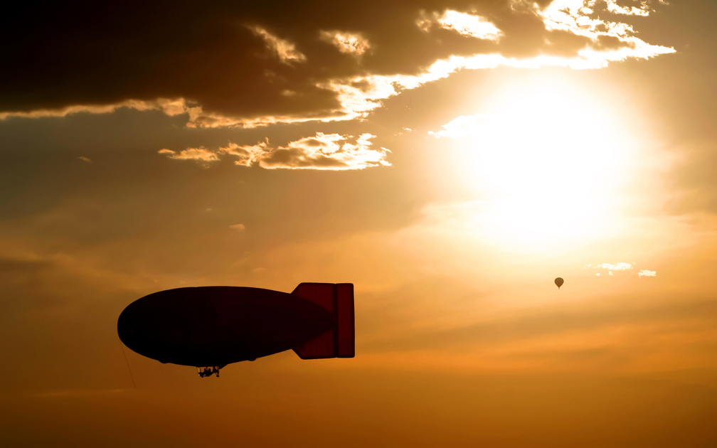 Blimp Silhouette and Hot Air Balloon