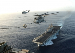 Helicopter Refueling Above an Aircraft Carrier