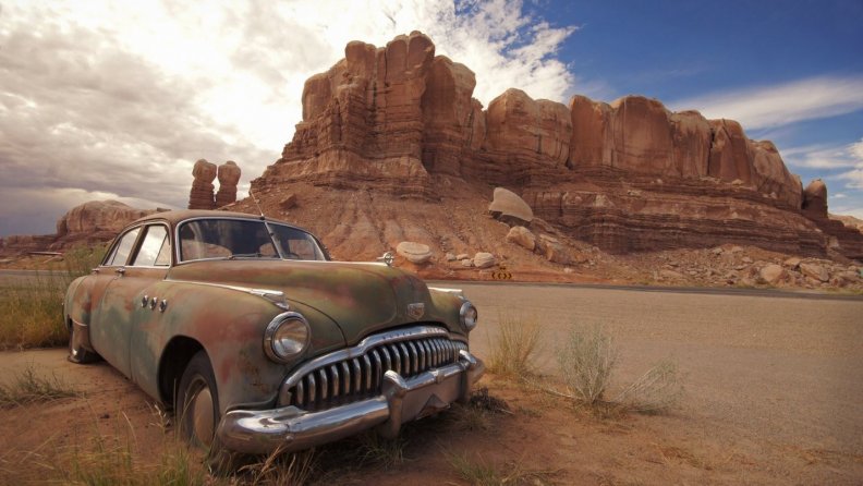 old buick at the end of the line in the desert