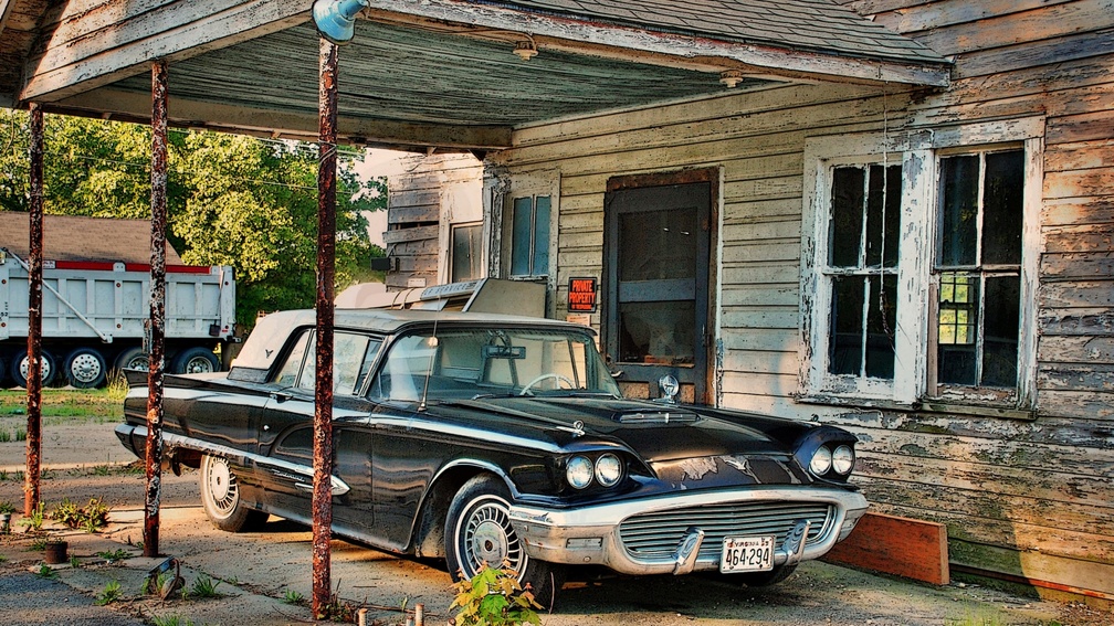 vintage ford thunderbird in old driveway hdr