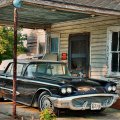 vintage ford thunderbird in old driveway hdr