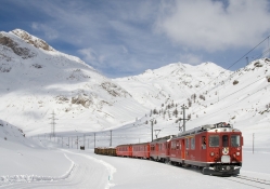 train going up a mountain in winter