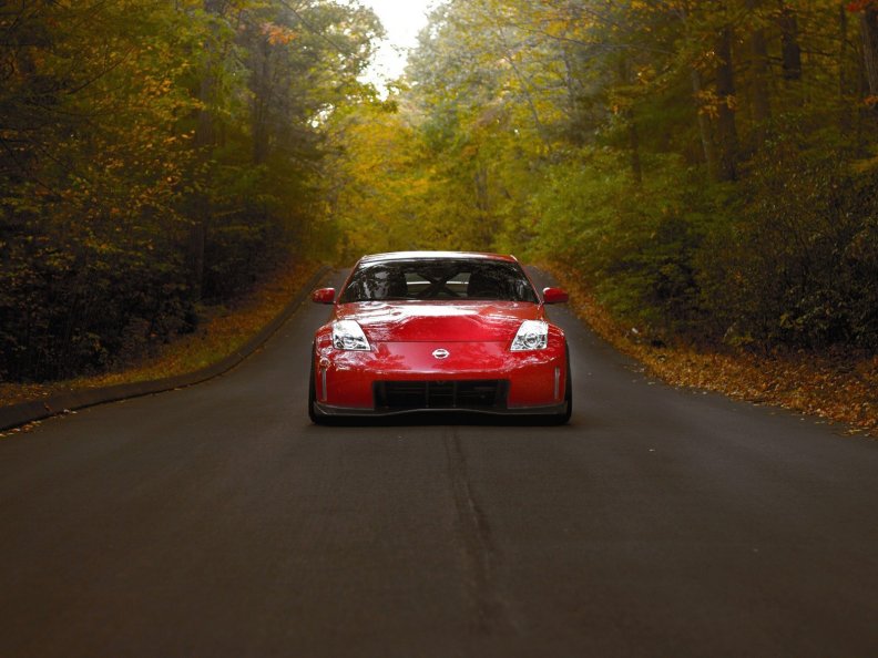 red_car_in_autumn_road.jpg