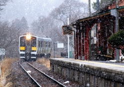 commuter train arriving in winter