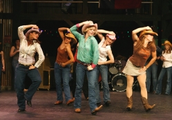 a chorus line of cowgirls