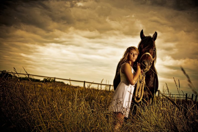 girl_and_horse_at_sunset_resting.jpg