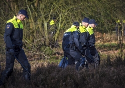 Dutch Policemen Searching for Evidence 01