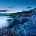 blue grey rocky seashore at twilight