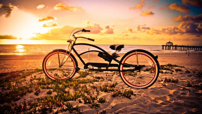 vintage_bicycle_on_a_beach_at_sunset.jpg