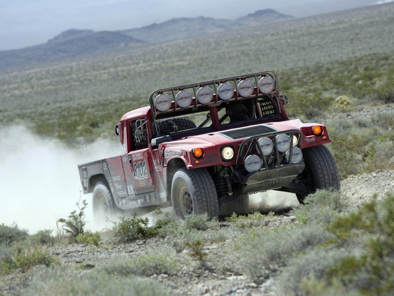 HUMMER DRIVING AT THE DESERT