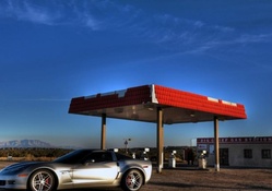 chevrolet corvette in a deserted gas station