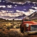 a rusted GMC pickup abandoned in a desert hdr