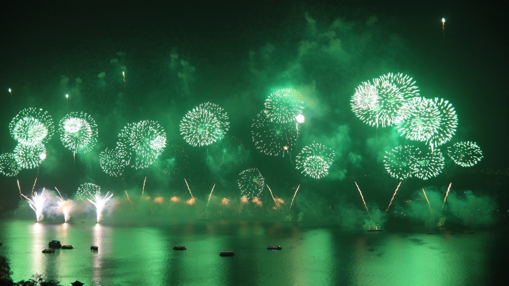 beautiful green fireworks in a harbor