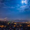 moonlit night over a vast city