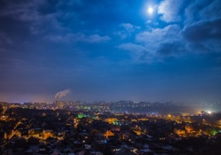 moonlit night over a vast city