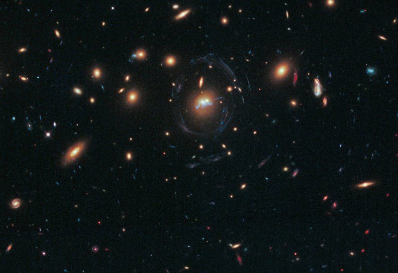 a_blue_bridge_of_stars_between_cluster_galaxies.jpg