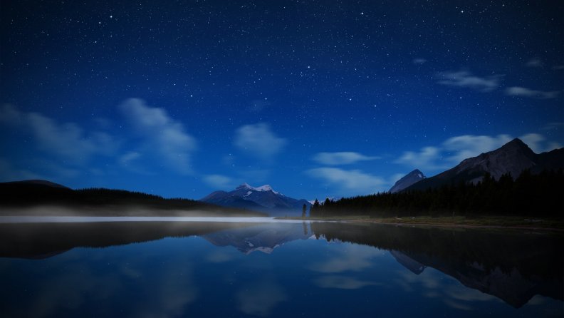 starry night over mountain lake