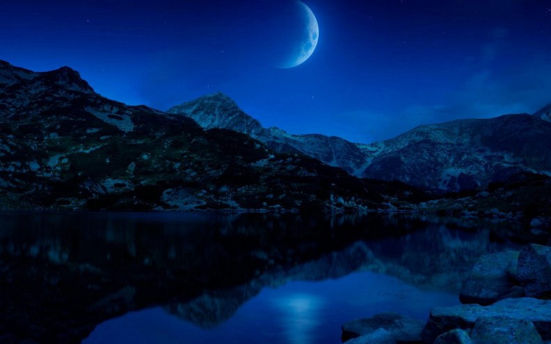awesome_moon_reflected_in_a_lake.jpg