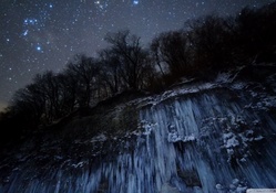 stars above an iced cliff