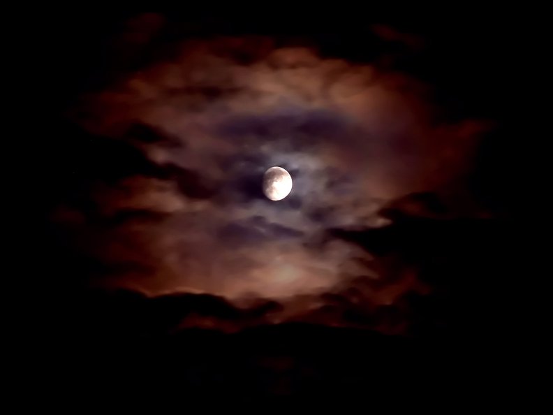 spooky_cloud_covered_moon.jpg