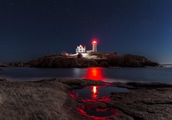 Lighthouse Beam in Starry Sky