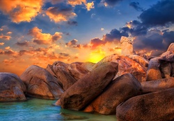 Sunrise Over The Rocks Beach