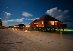 Tropical Beach Bungalows at Night