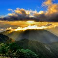 Clouds and Sun Rays over Mountains