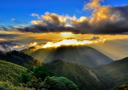 Clouds and Sun Rays over Mountains