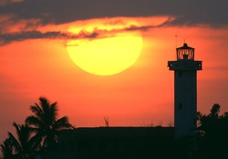 Sunset over Lighthouse and Trees